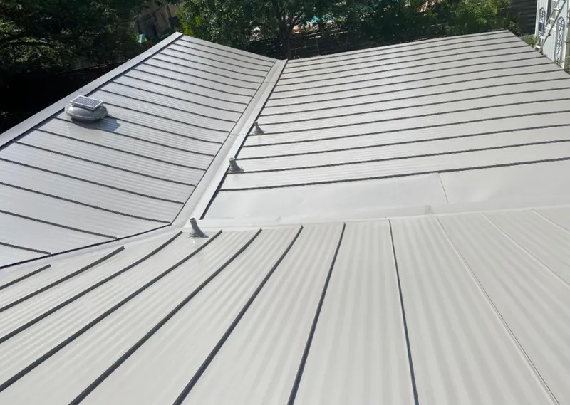 Solar attic fan installed on a metal roof for Roof Ventilation in Atherton